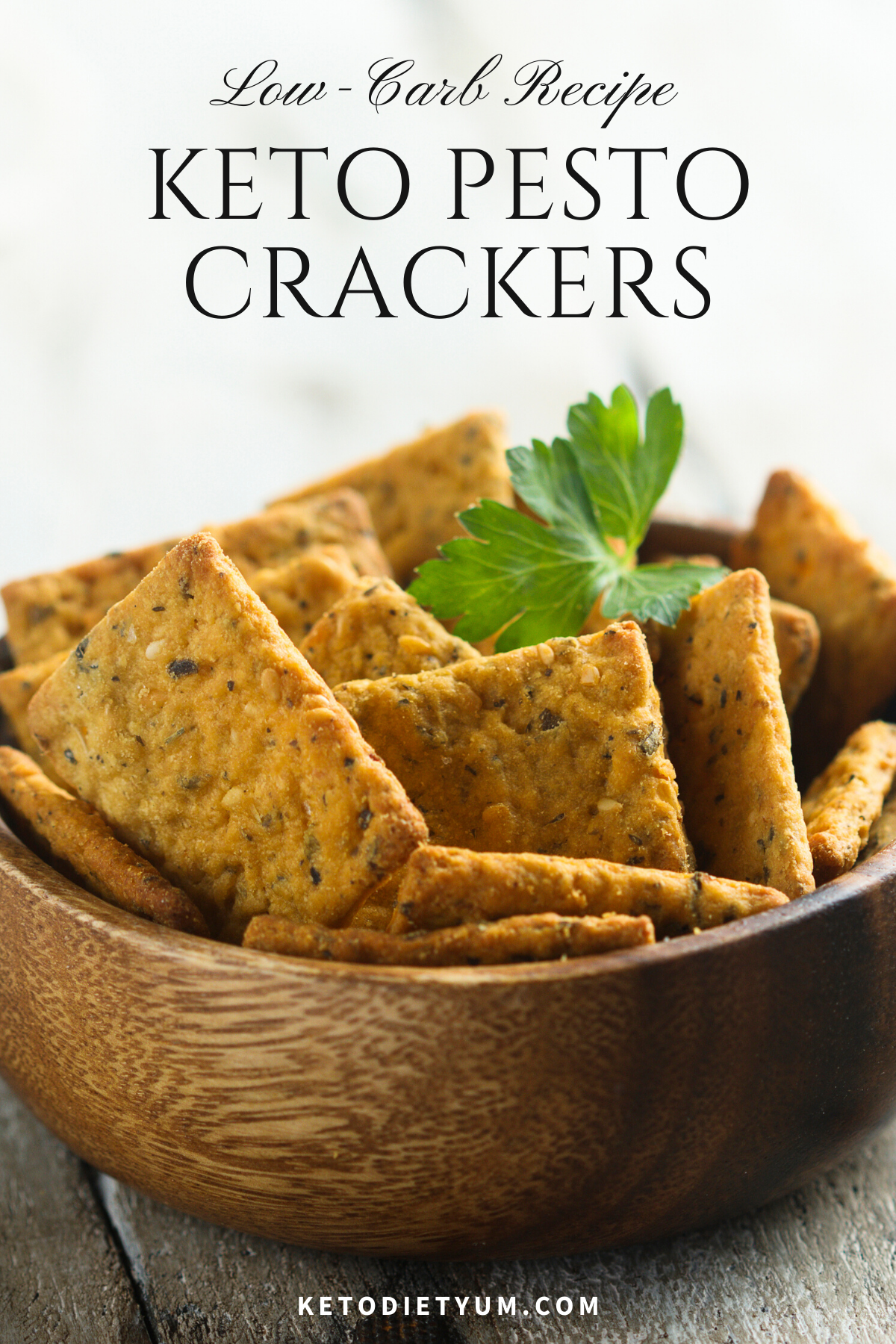 These delicious Keto Pesto Crackers have a crispy buttery texture that is to die for. A beautiful Italian taste with the combination of basil, garlic, black pepper and a hint of cayenne to give them a kick! Enjoy them with cheese or with your favorite soup or salad. #ketodiet #ketorecipes #lowcarbrecipes