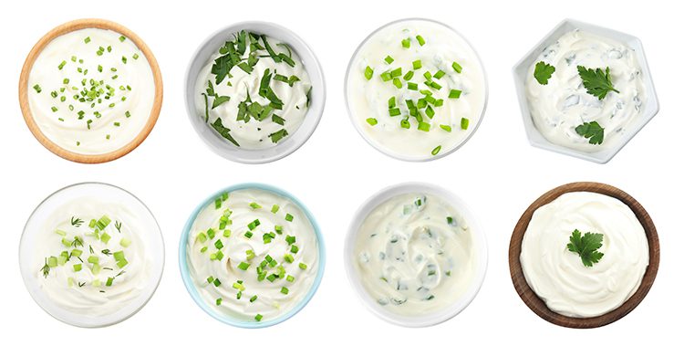 Different types of sour cream in different bowls