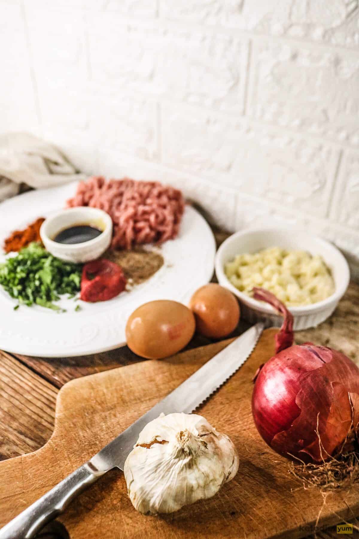 Ingredients for classic keto meatloaf arranged on a table