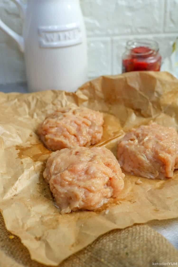 Raw chicken patties ready to be cooked