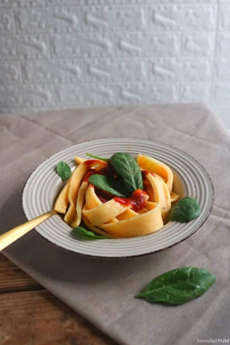 keto pasta with marinara sauce and basil leaves