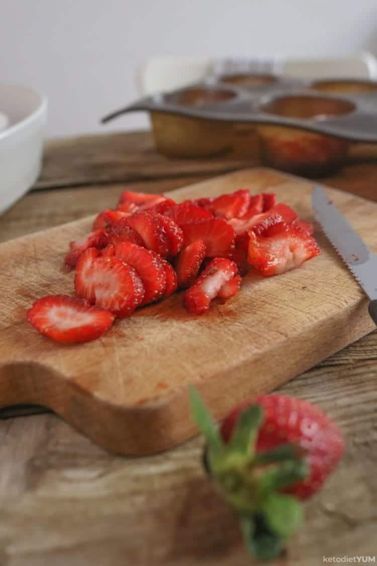 Sliced strawberries for keto cupcakes