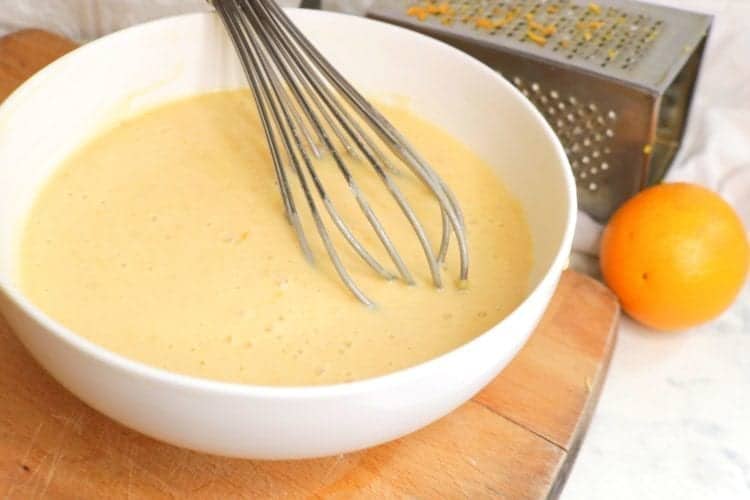 Mixing the ingredients to make orange cake batter