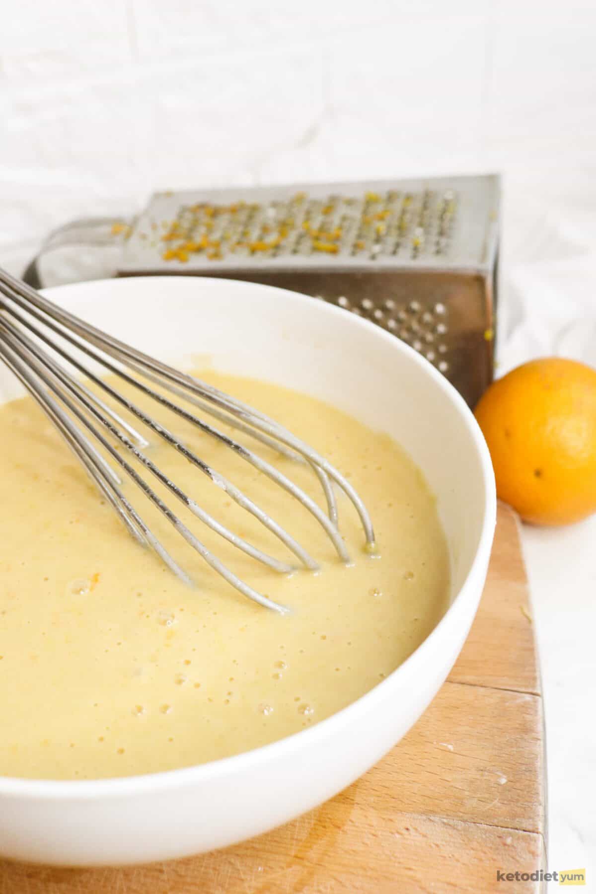 Mixing the ingredients to make orange cake batter