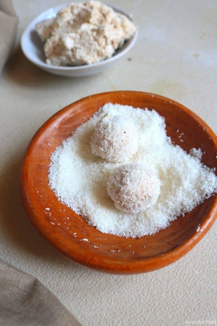 Rolling fat bombs in shredded coconut