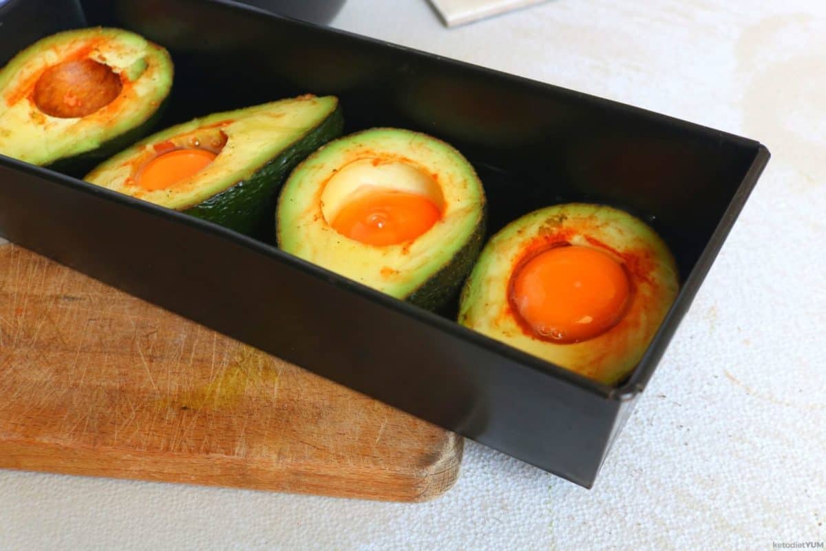 Seasoned avocado egg boats ready to bake