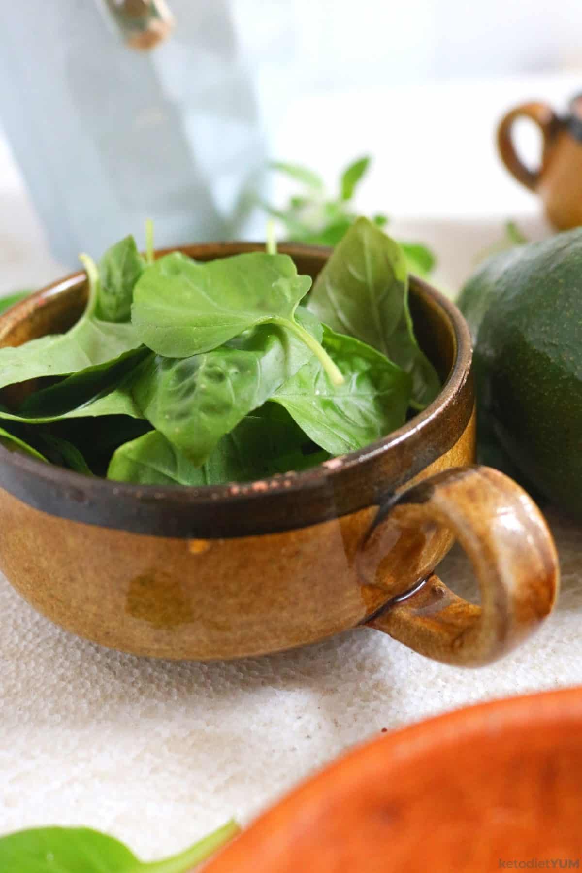 Fresh basil in a bowl ready to chop