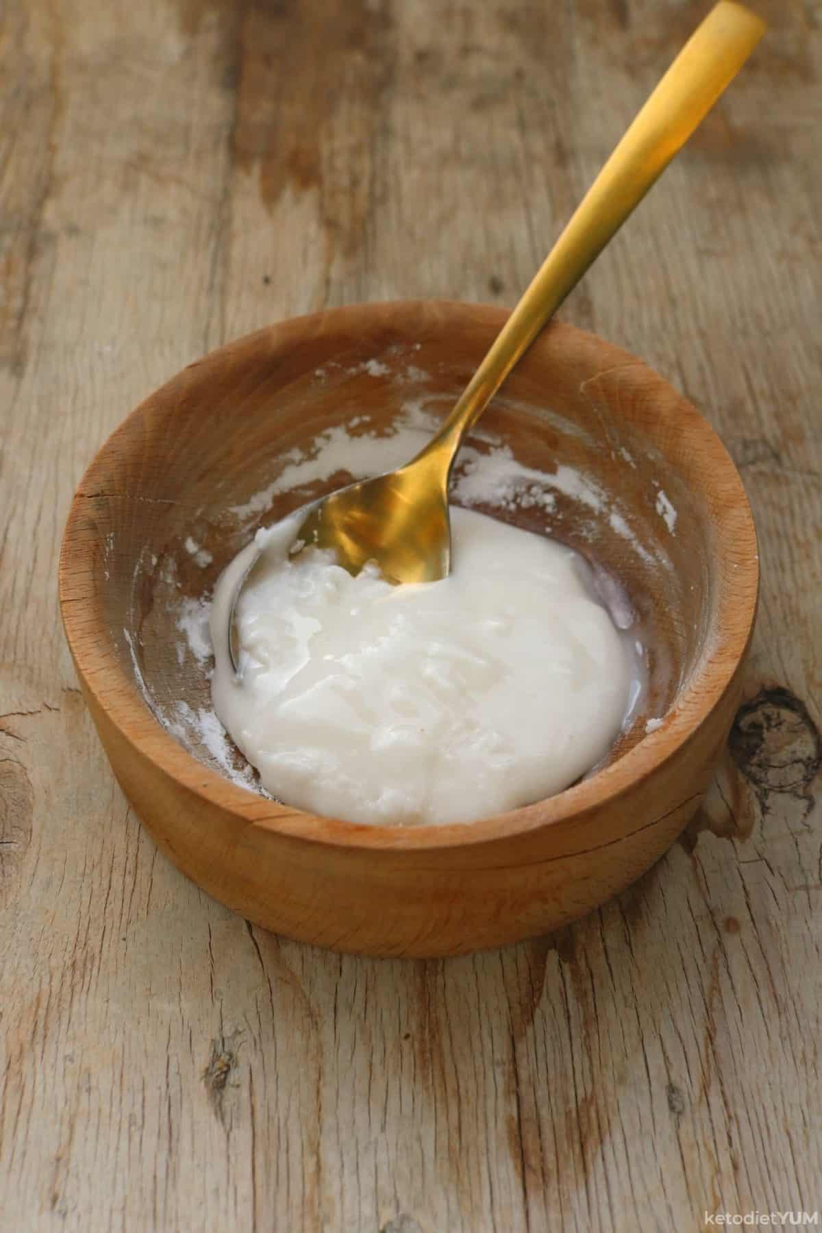 Wet ingredients in a bowl being combined to make cookie dough