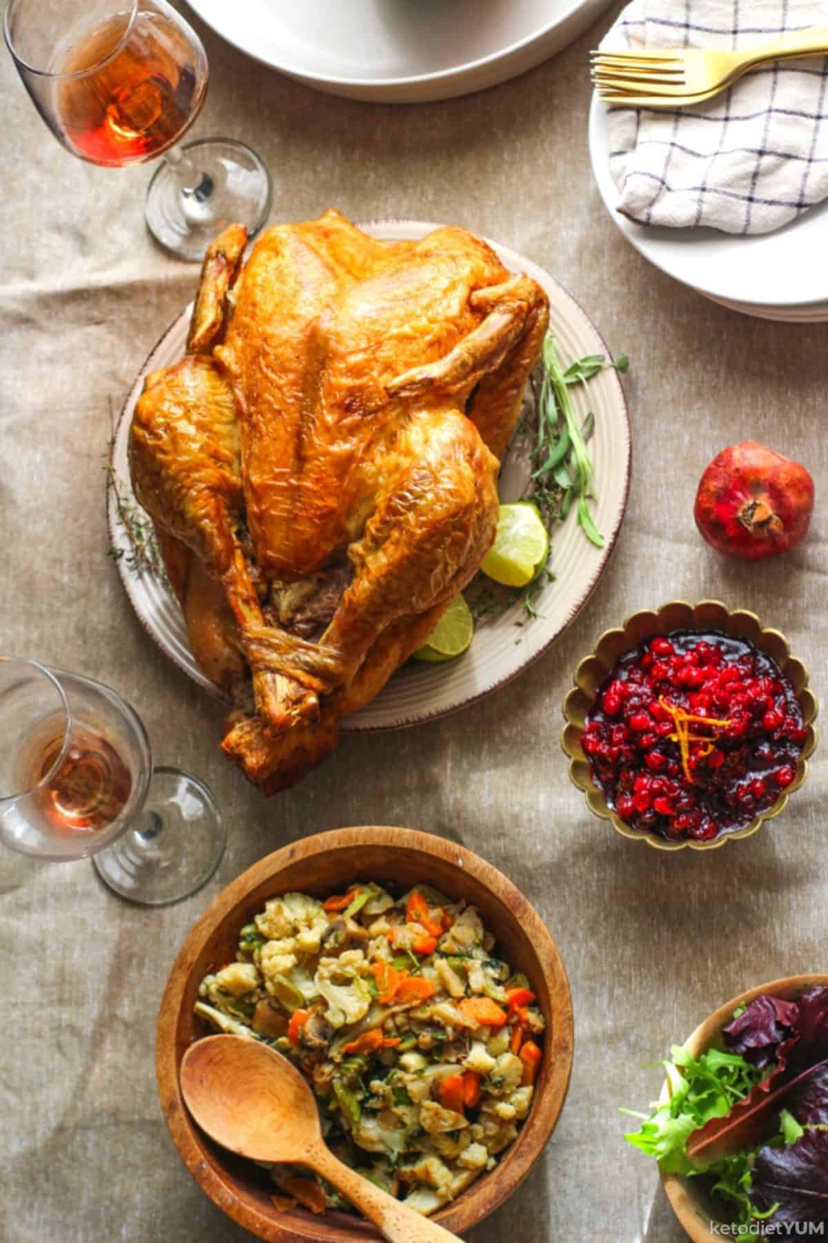 Delicious roast turkey Thanksgiving dinner with cauliflower stuffing and cranberry sauce