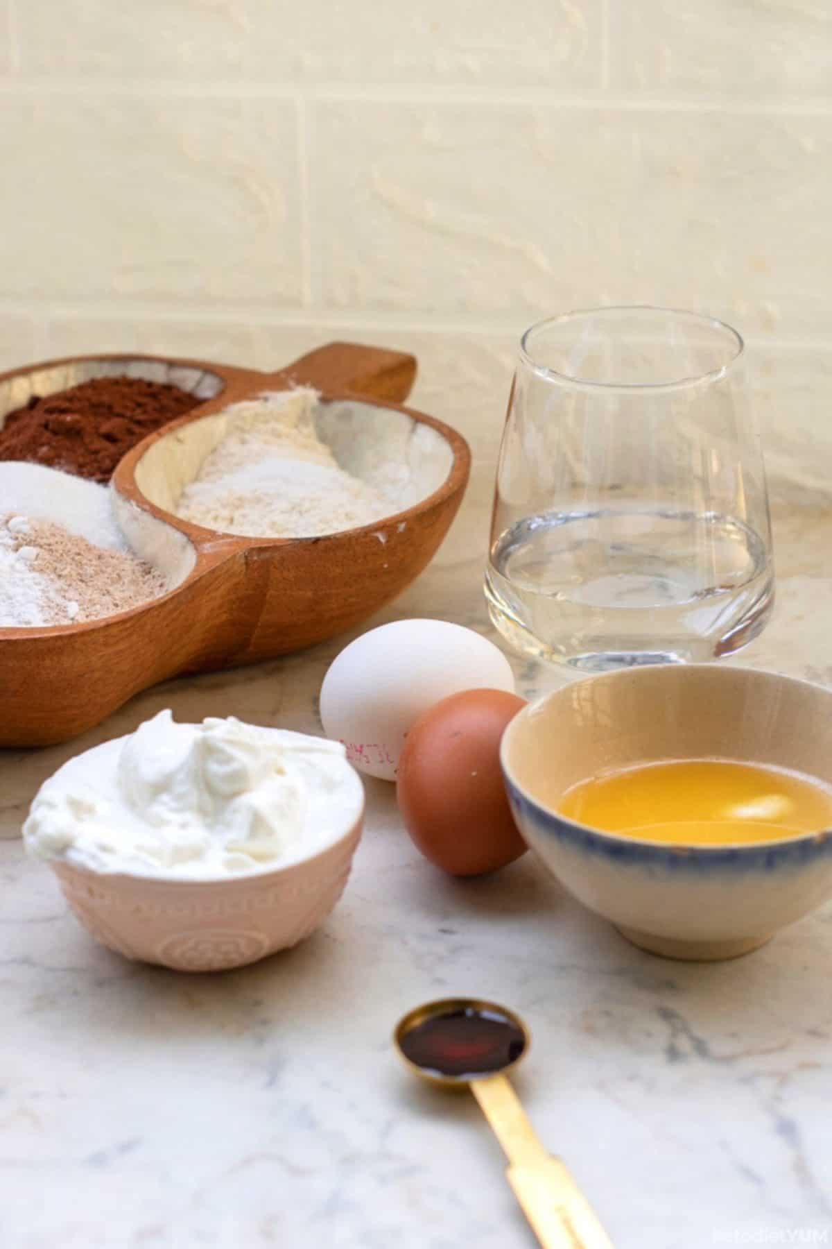 Ingredients on a table needed to make the best keto chocolate cake