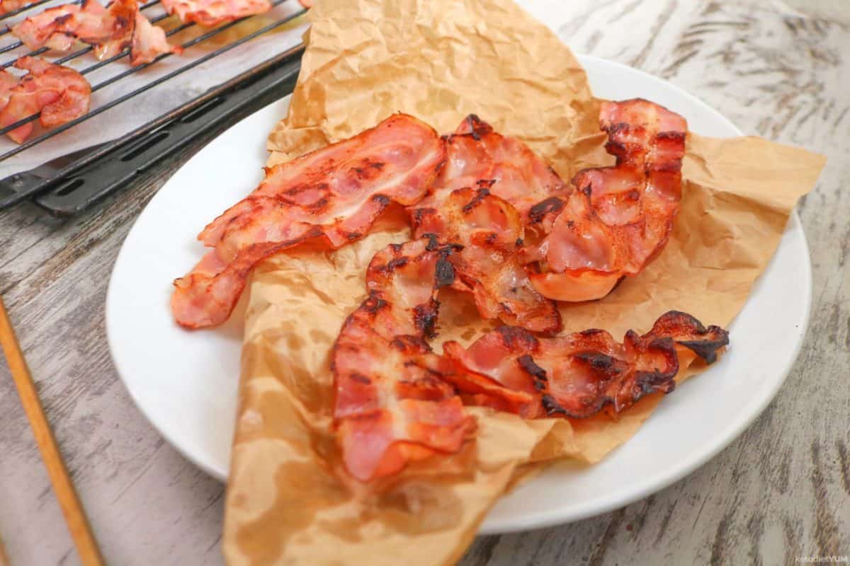 Delicious crispy bacon cooked to perfection in a pan