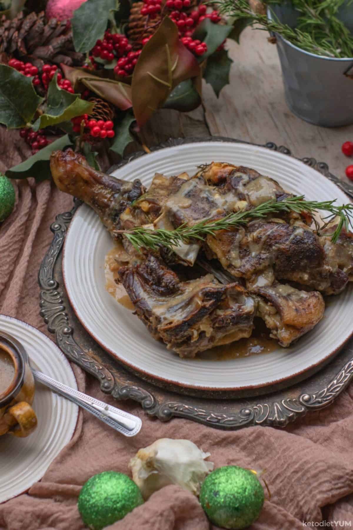 Low carb roast leg of lamb on a festively decorated table ready to eat