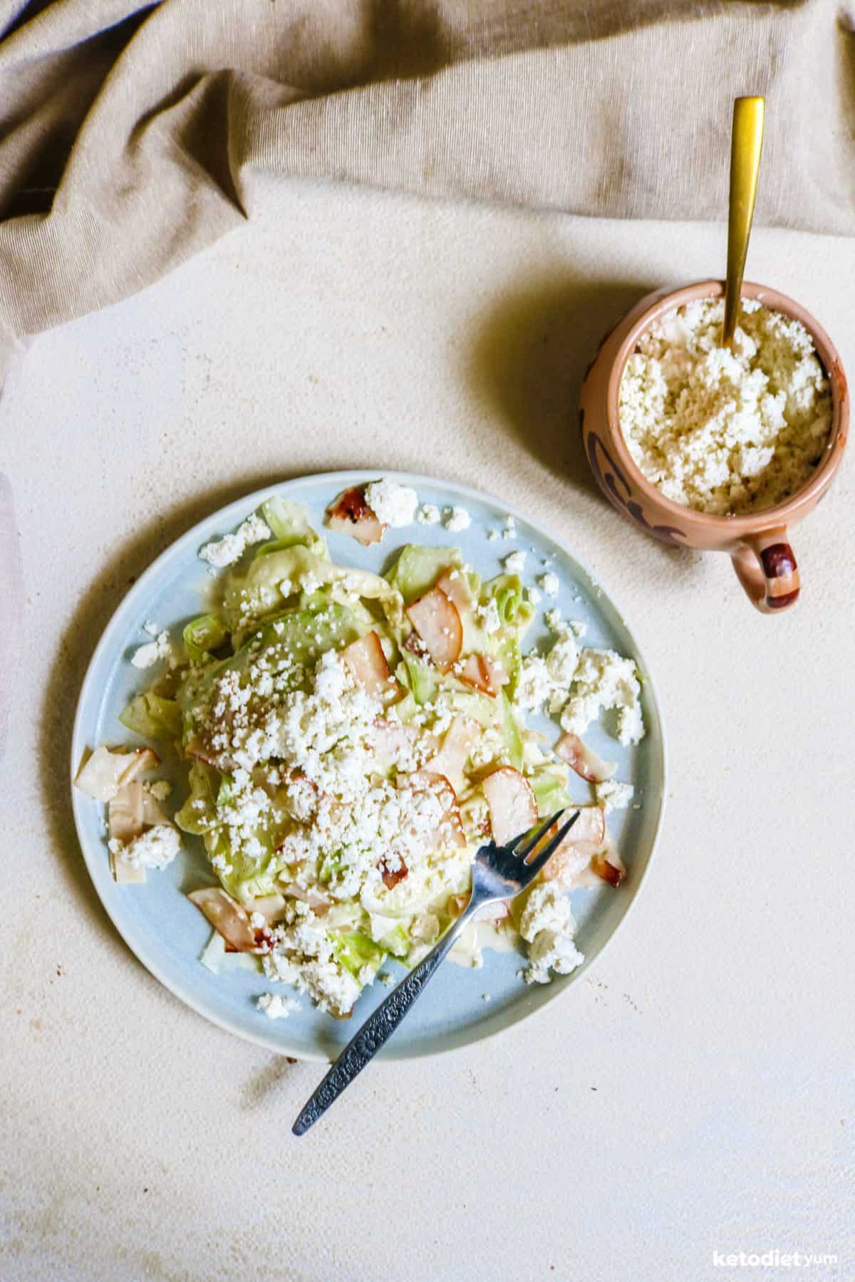 Perfect zucchini noodles alfredo served with crispy bacon and goat cheese