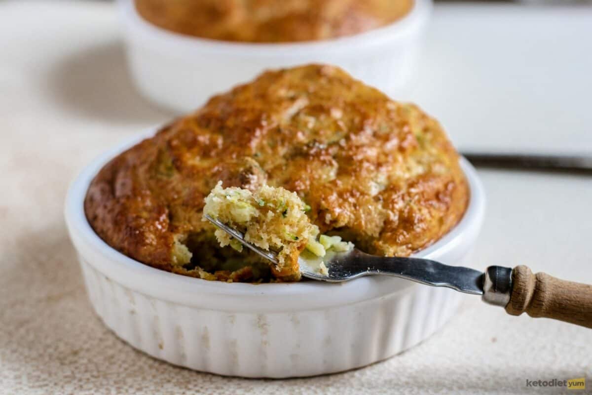 A delicious keto quiche in a white ramekin with showing the moist and tender inside layer