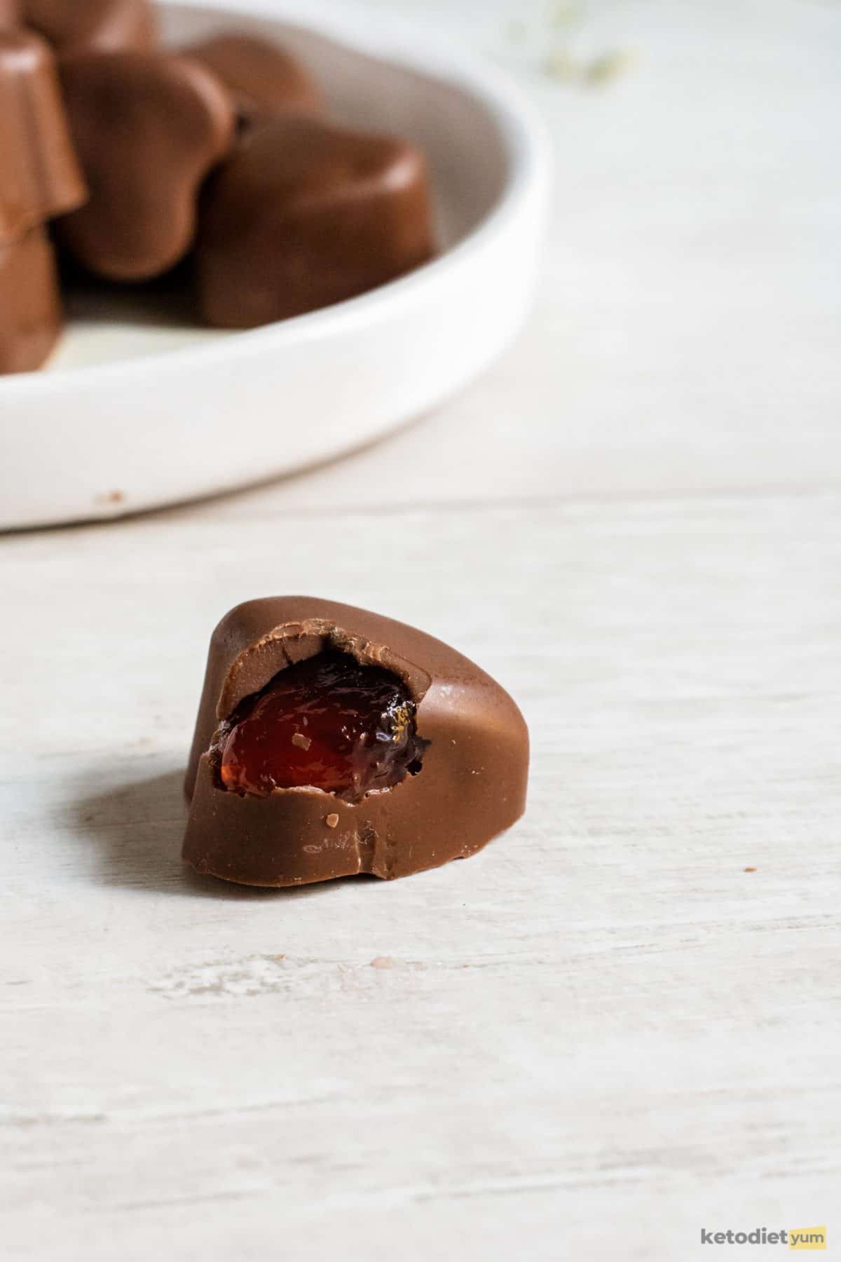 3 Ingredient Keto Chocolate Hearts A low carb keto chocolate heart with a bite taken out of it