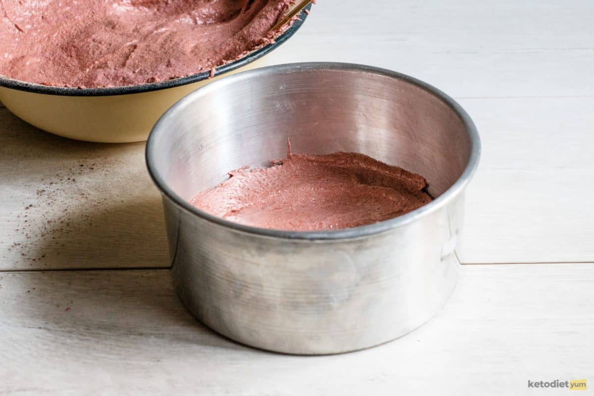 Pouring the cake batter into a round baking pan