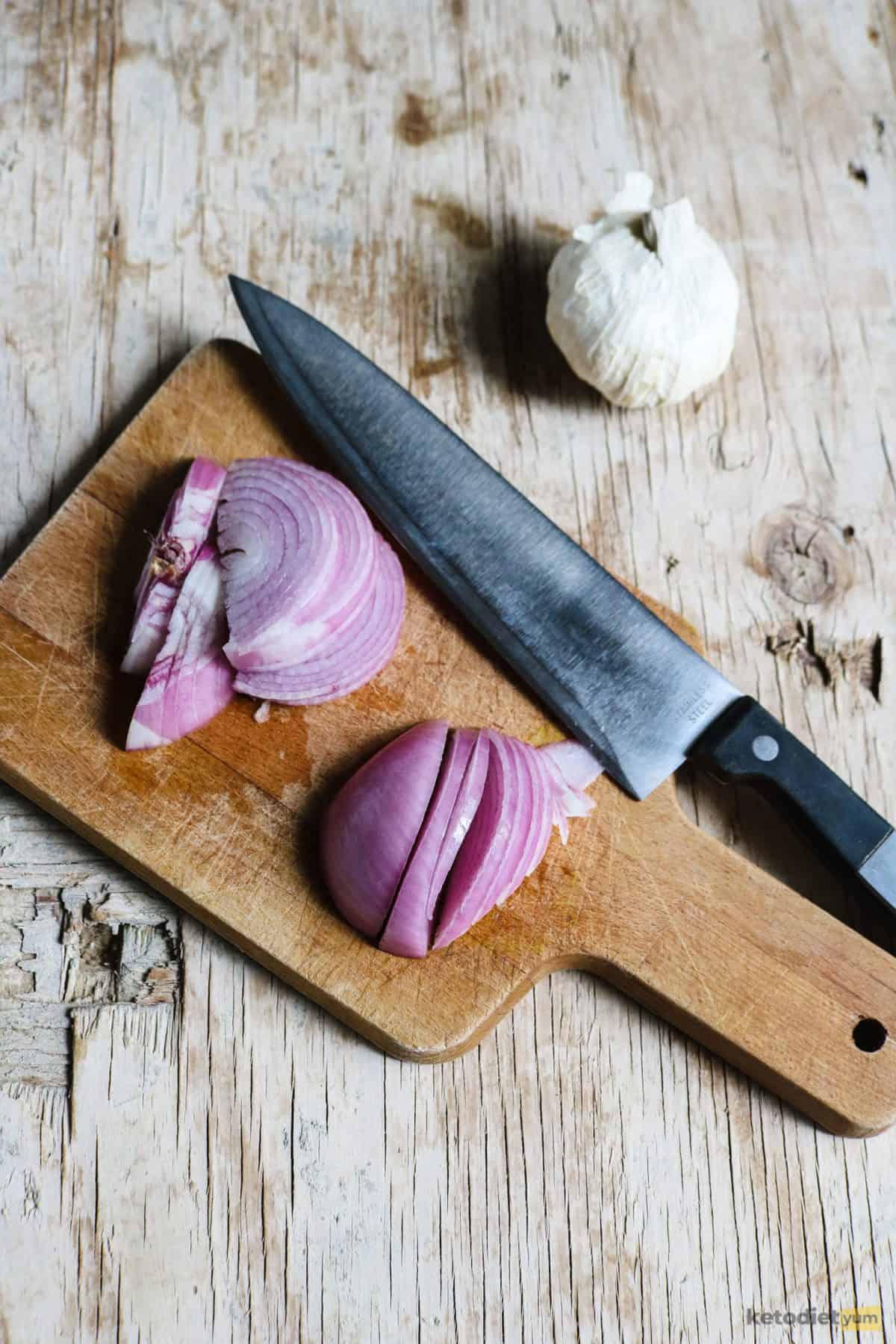 A red onion roughly sliced to add to the zucchini casserole