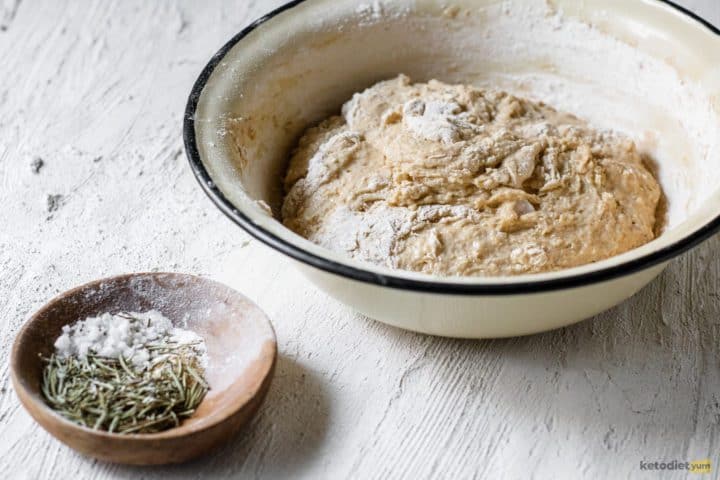 Kneaded dough in a mixing bowl ready to transfer to a baking pan