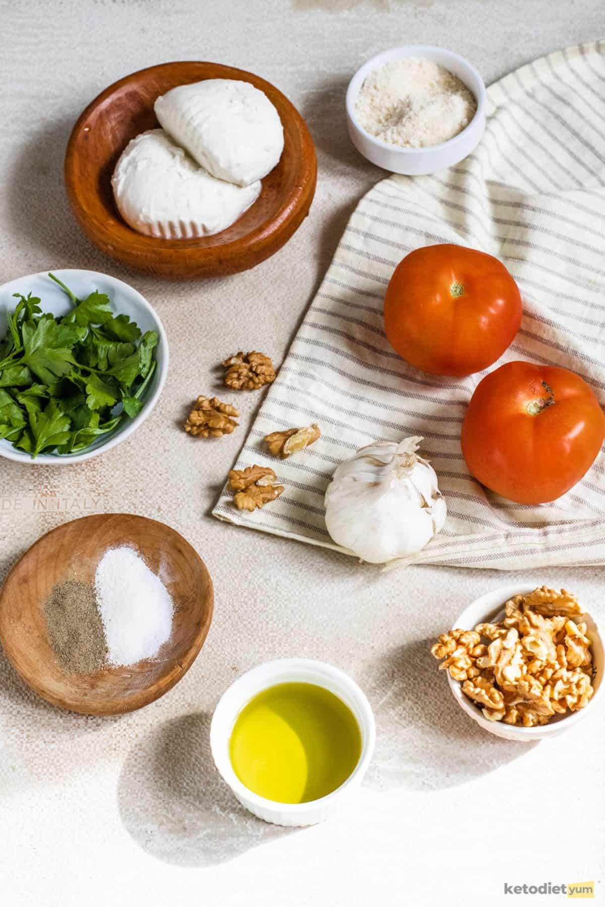 Simple and fresh ingredients on a table to make a keto caprese salad
