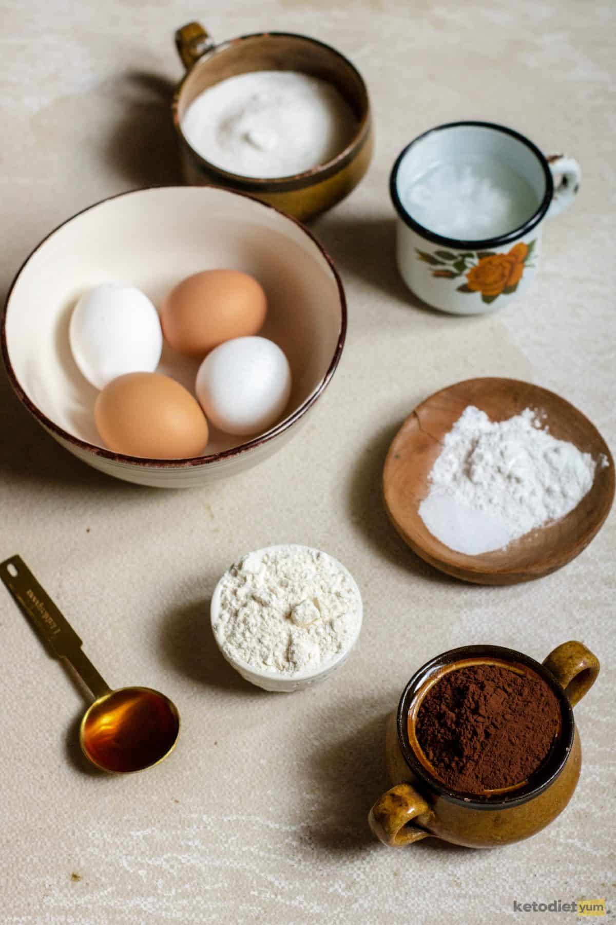 Ingredients arranged on a table required to make chocolate keto pie