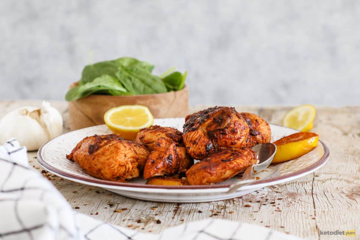Crispy and tender peri peri chicken breasts on a plate