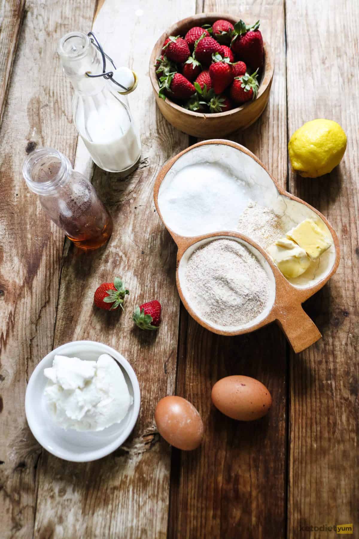 Ingredients arranged on a table needed to make a keto strawberry tart