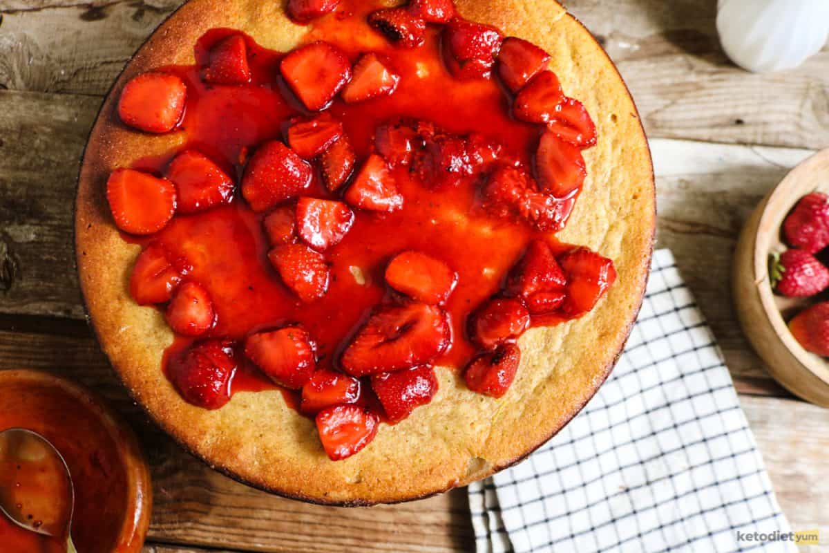 A low carb strawberry cream cheese tart topped with a fresh strawberry sauce and ready to slice