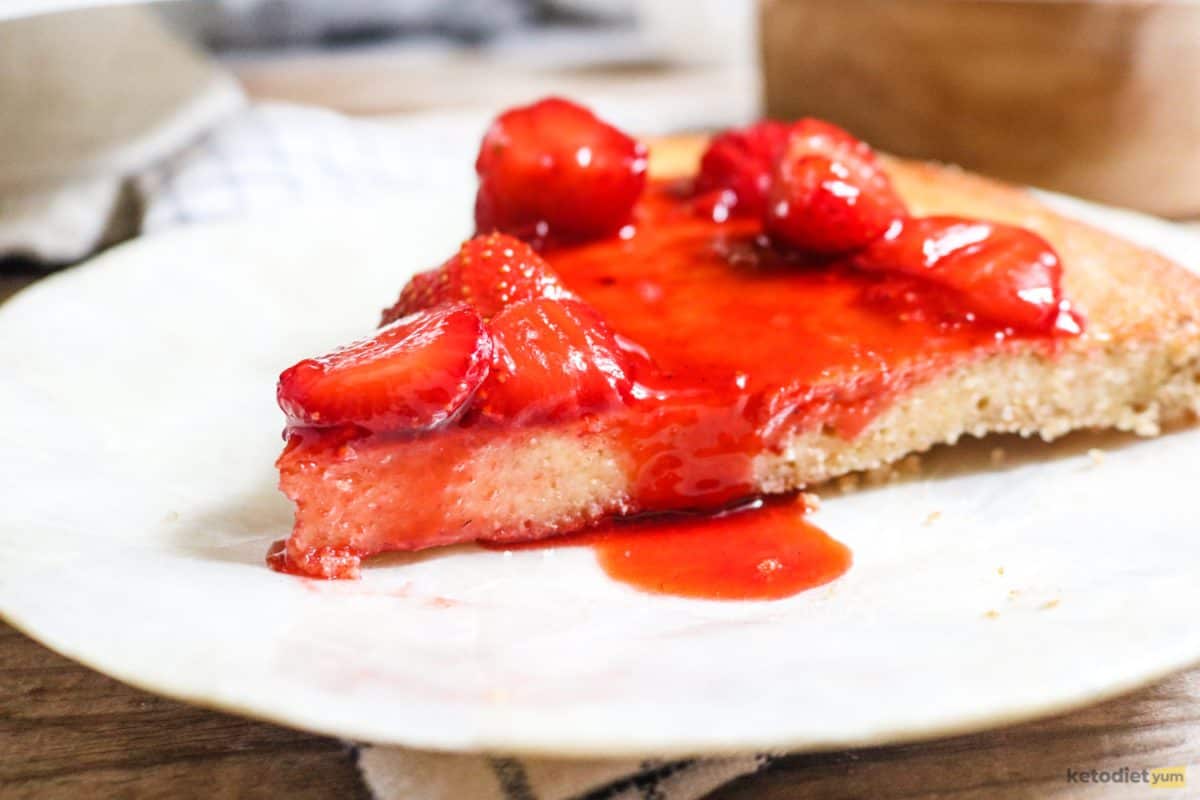A slice of keto strawberry cream cheese tart on a white plate