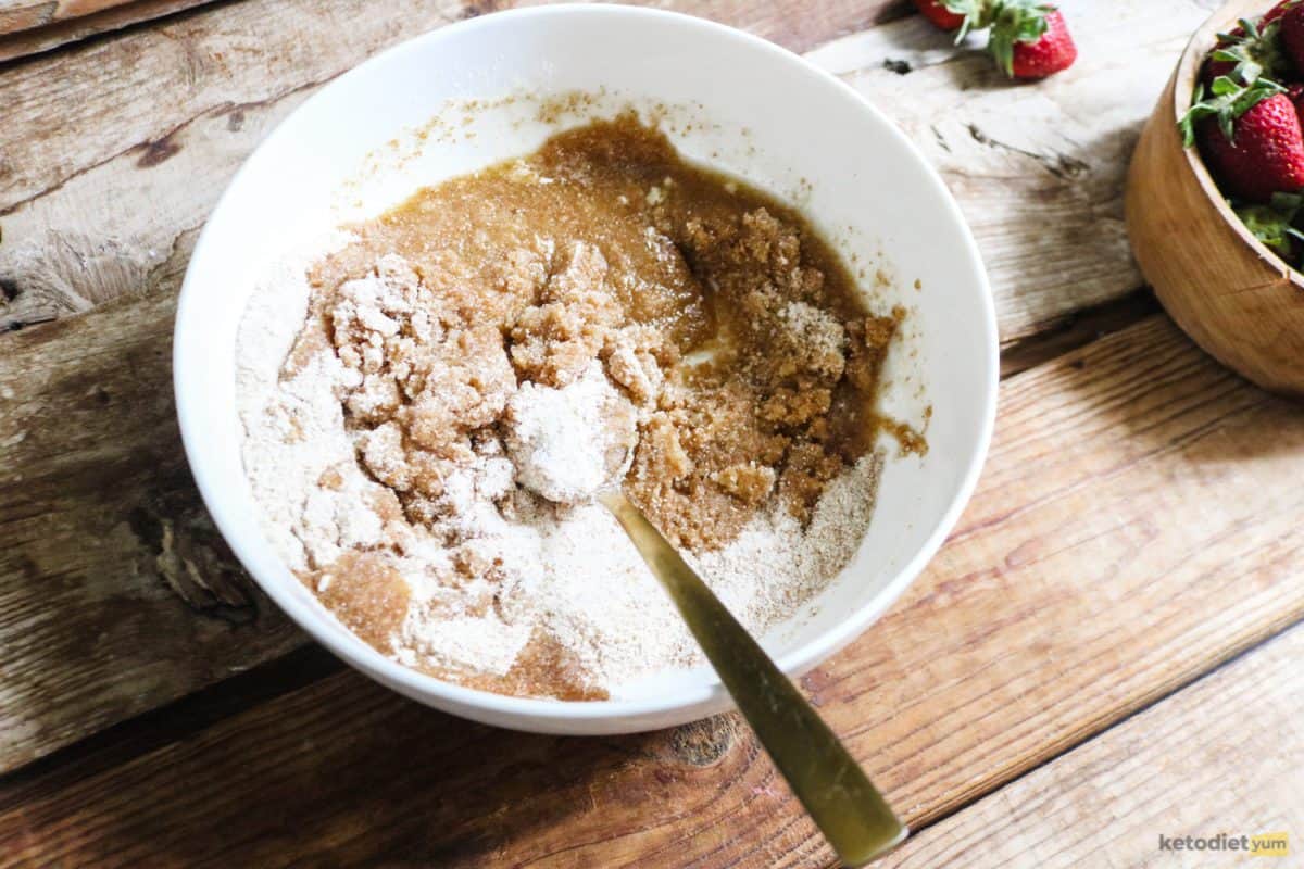 Combining almond flour, Erythritol and butter to make the cream cheese tart base