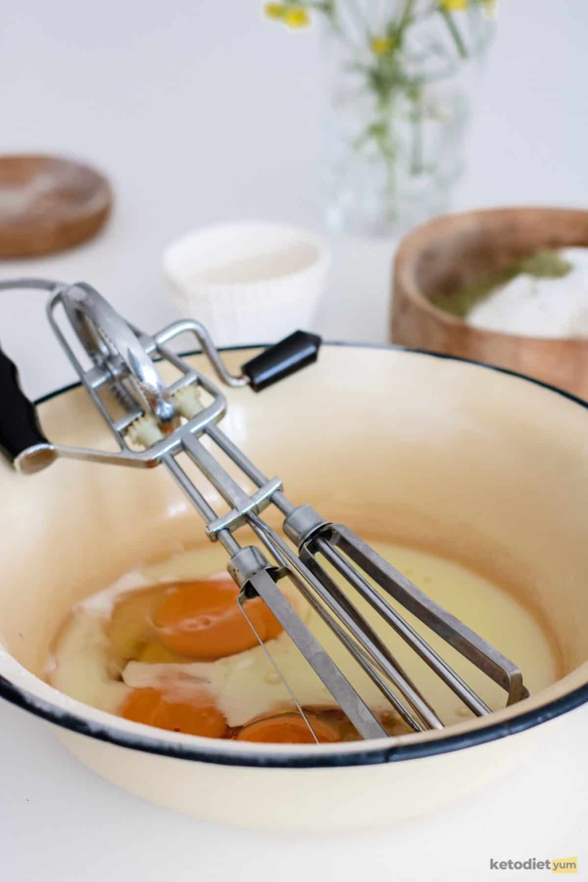 Mixing together the wet ingredients to make keto matcha cupcakes