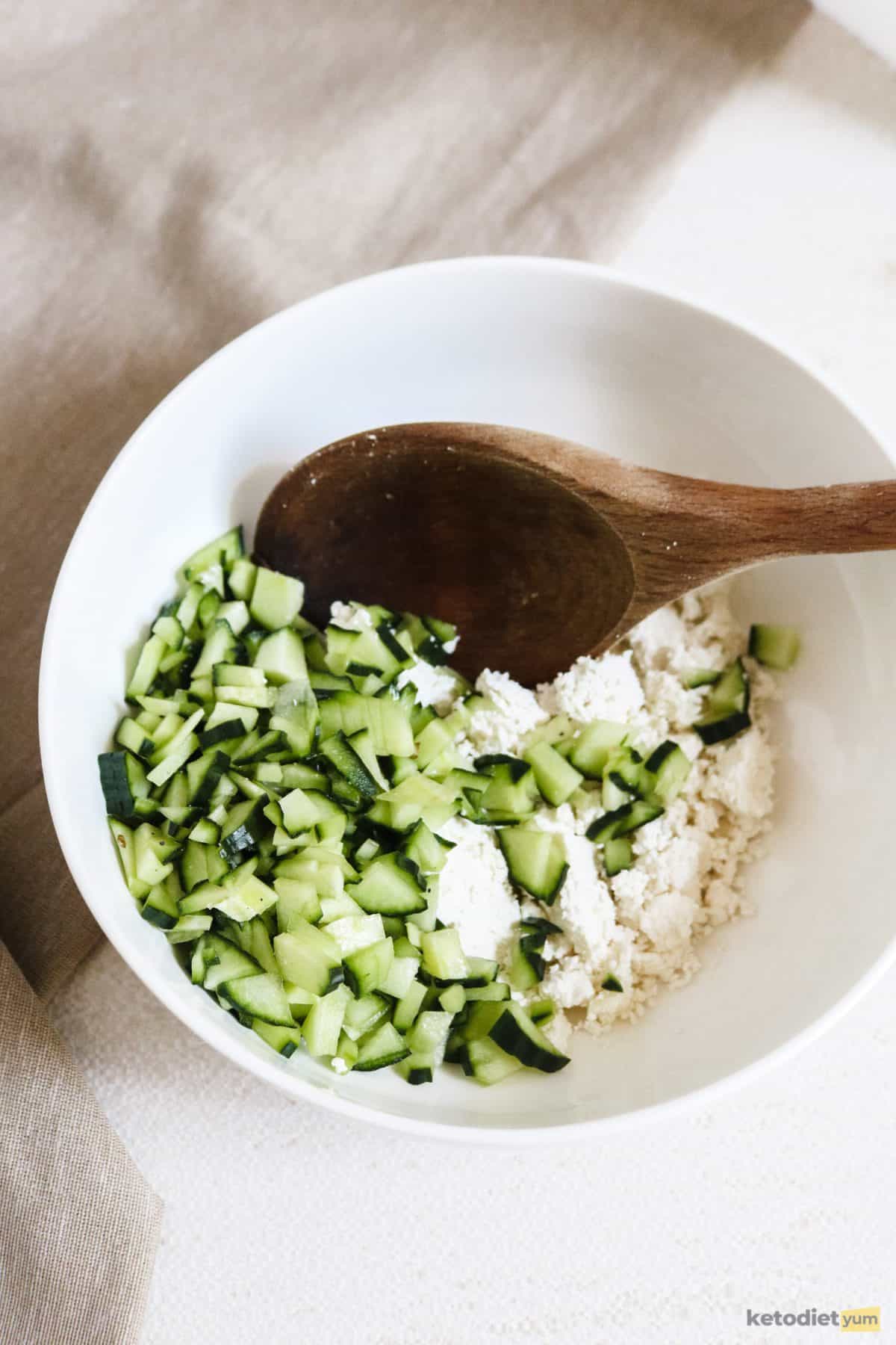 Preparing the goat cheese and cucumber dip