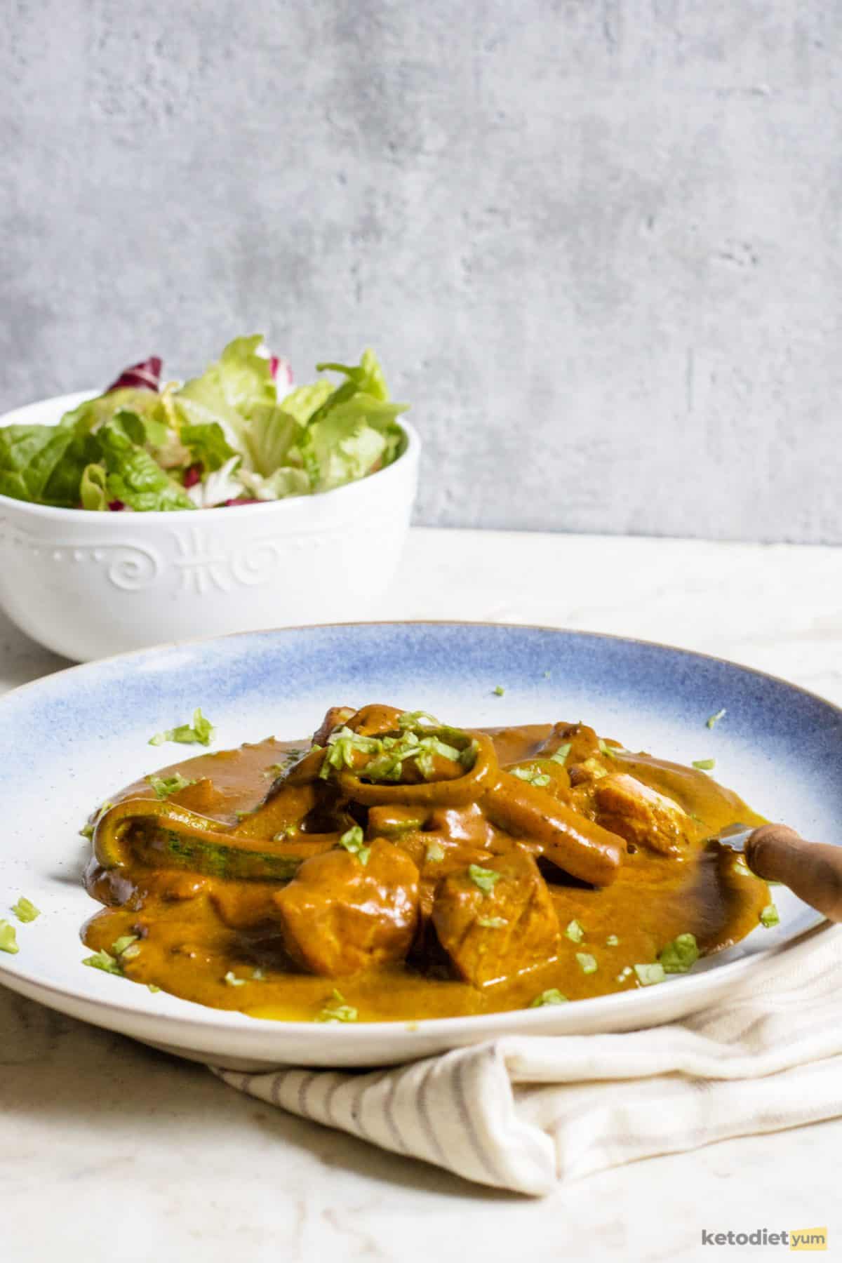 A yummy low carb keto salmon coconut curry with side salad