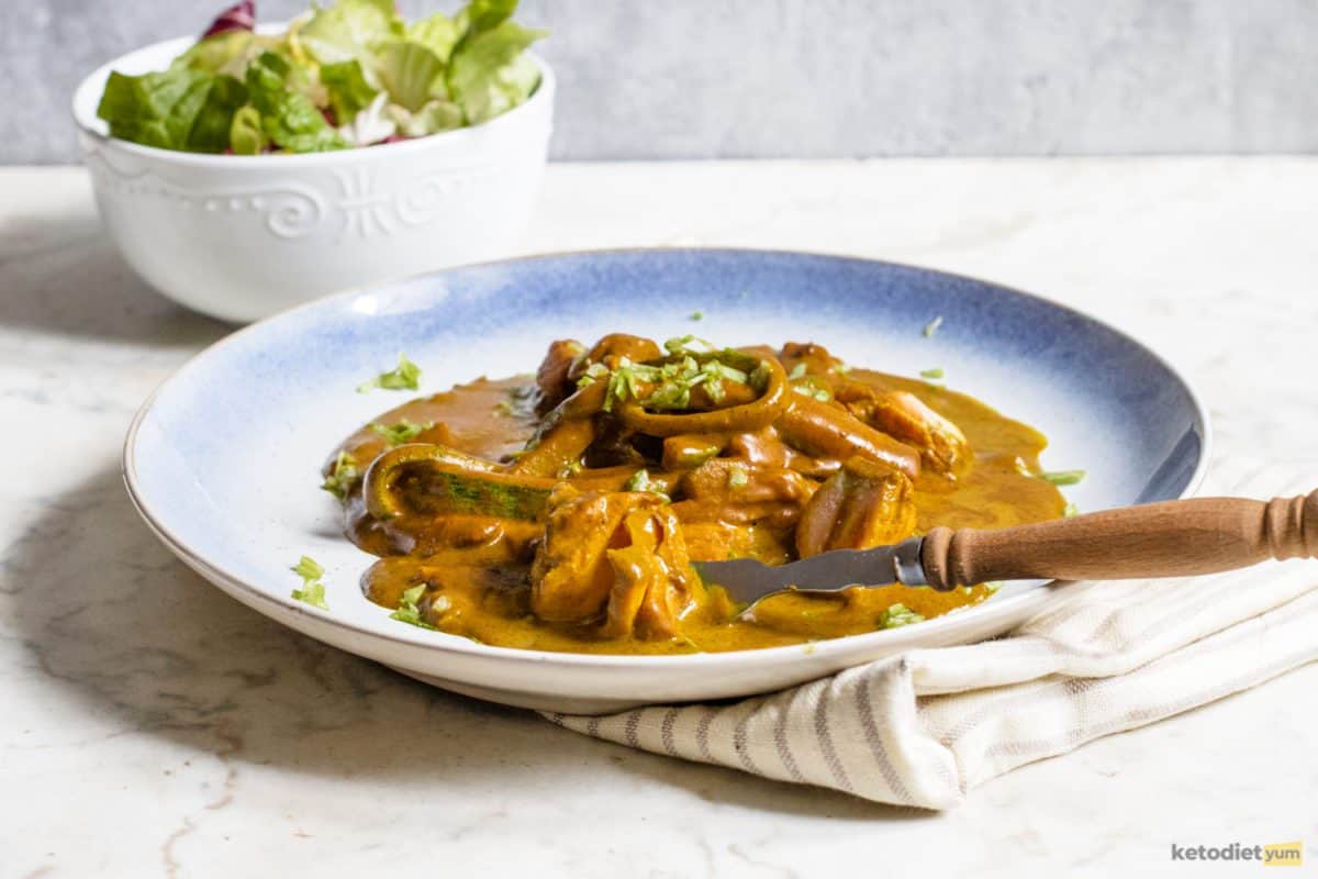 A delicious coconut salmon curry served on a white plate