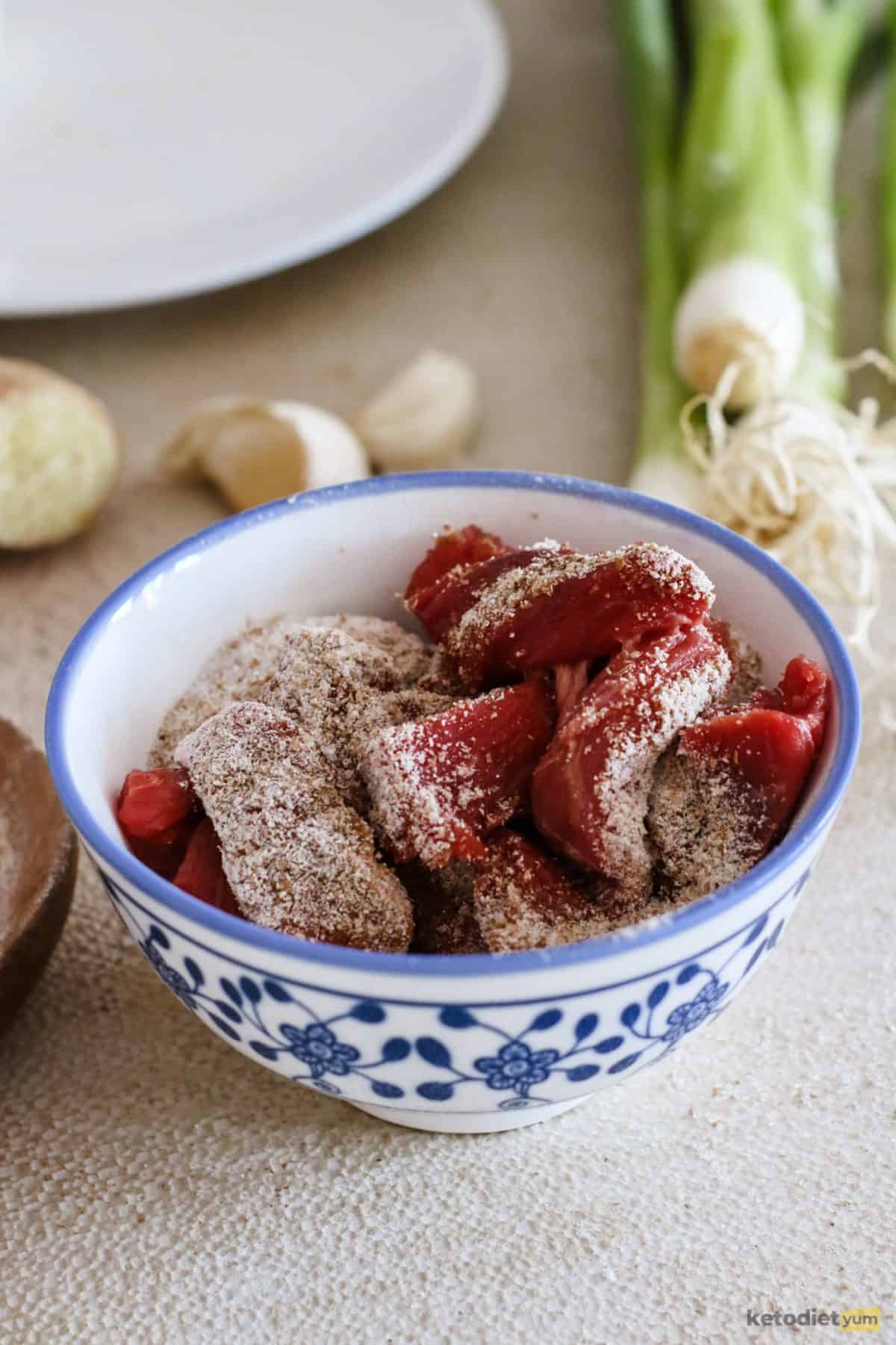 Slices of beef marinating in almond flour, soy sauce and vegetable oil