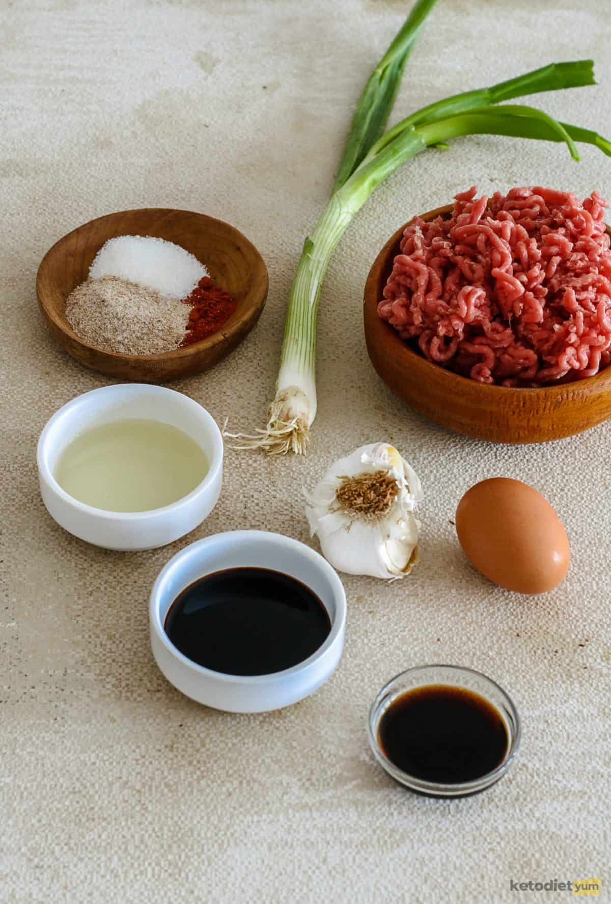 Ingredients arranged on a table used to make low carb keto Kung Pao meatballs