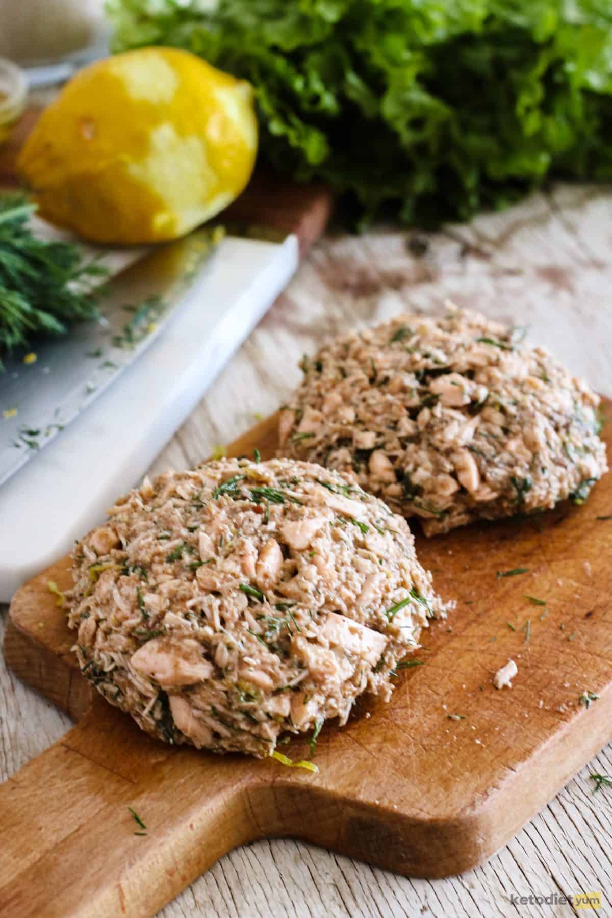 Salmon burger mixture shaped into burgers and ready to cook