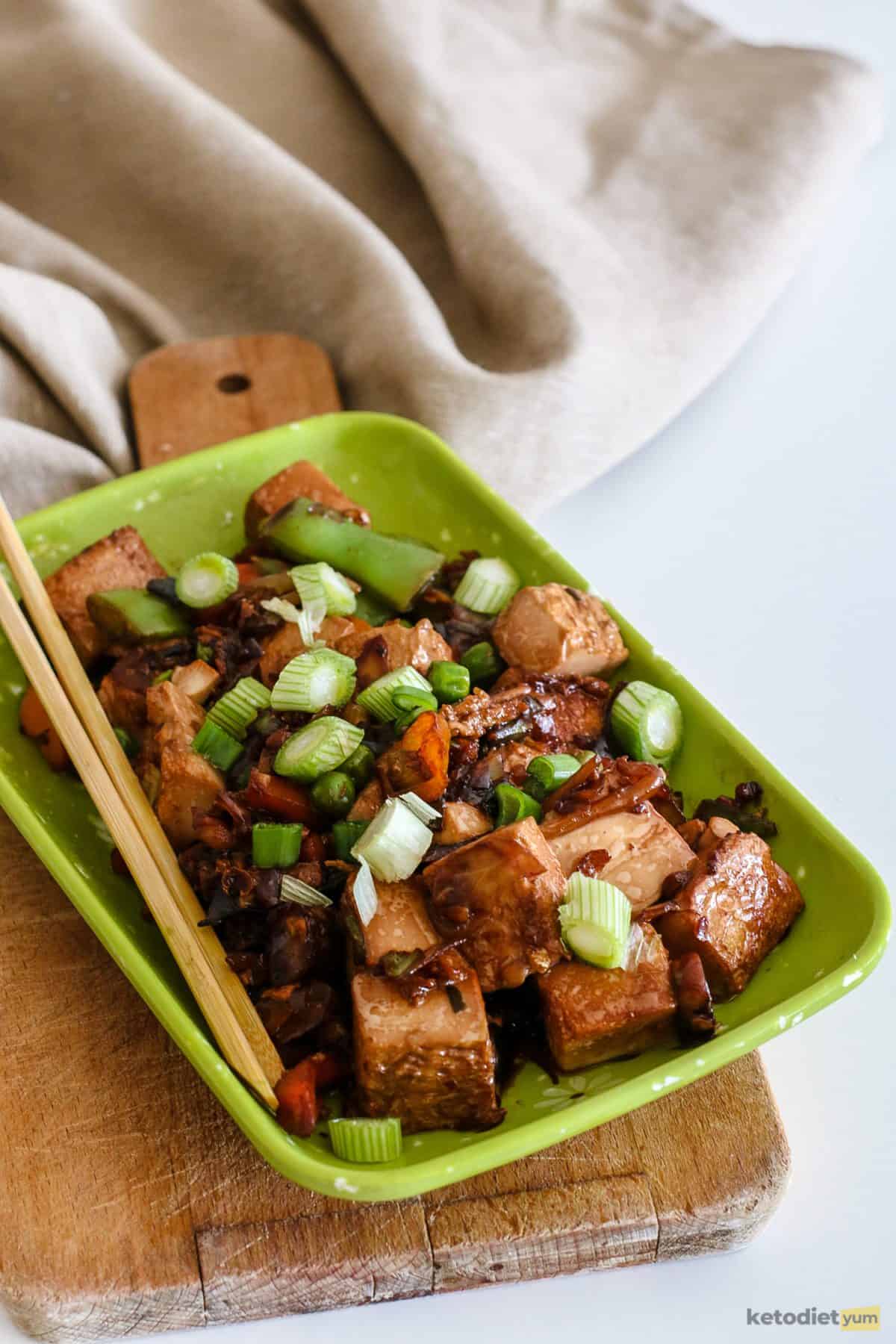 Vegetarian tofu stir fry garnished with green onions