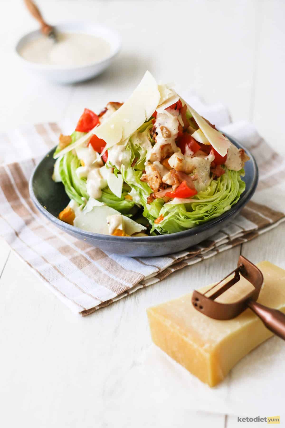 A delicious Caesar Wedge Salad served in a blue bowl on a table
