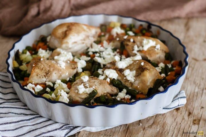 Adding feta cheese to the roasted chicken and vegetables before returning to the oven to bake a further 10 minutes
