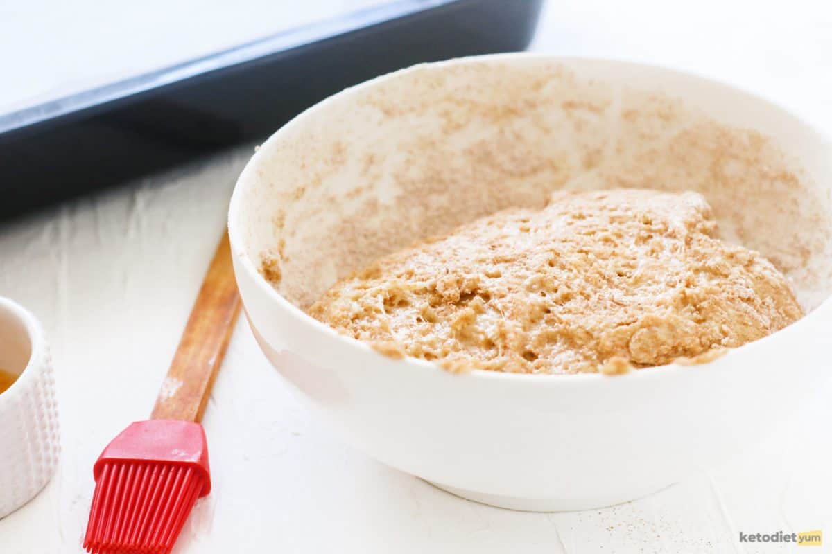 Low carb bread roll dough in a white bowl ready to roll into balls and bake