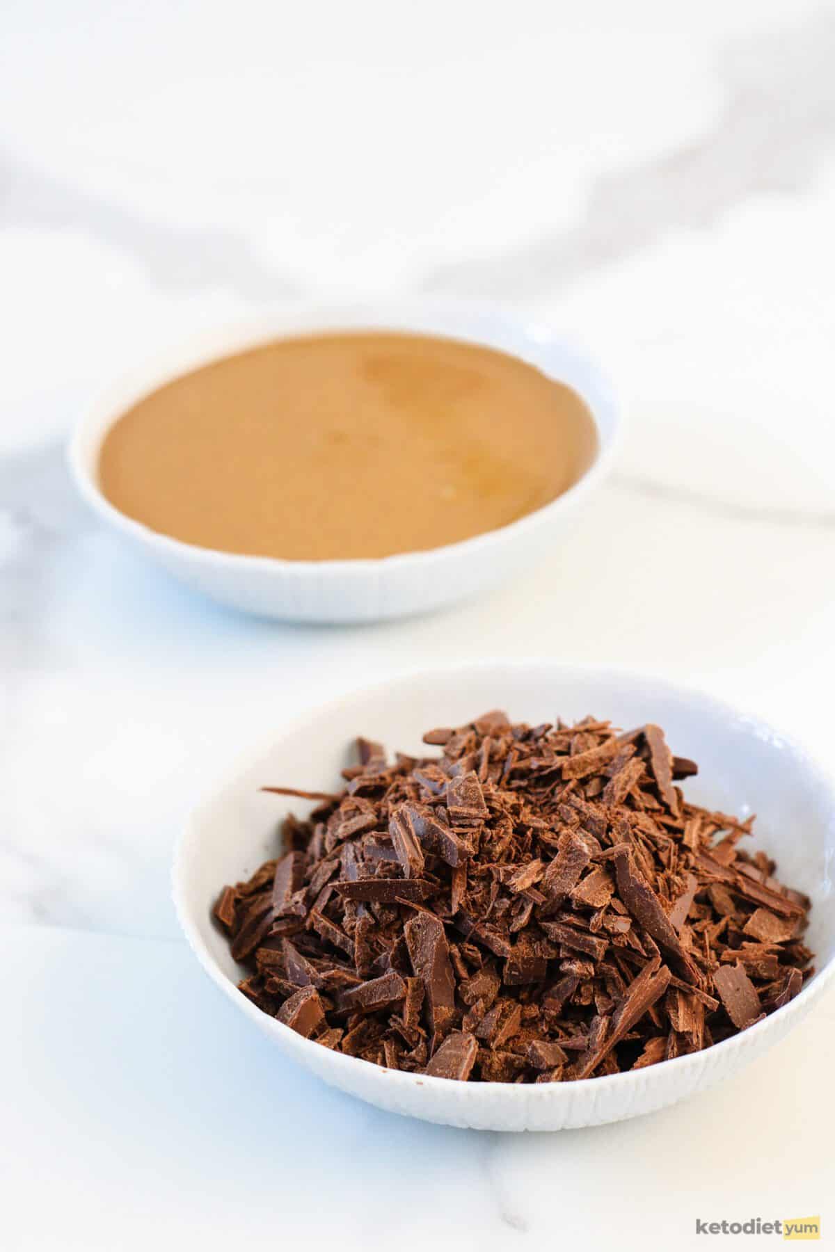 Keto Chocolate Peanut Butter Fudge Sugar free chocolate and natural peanut butter in two bowls ready to be used to make keto chocolate peanut butter fudge