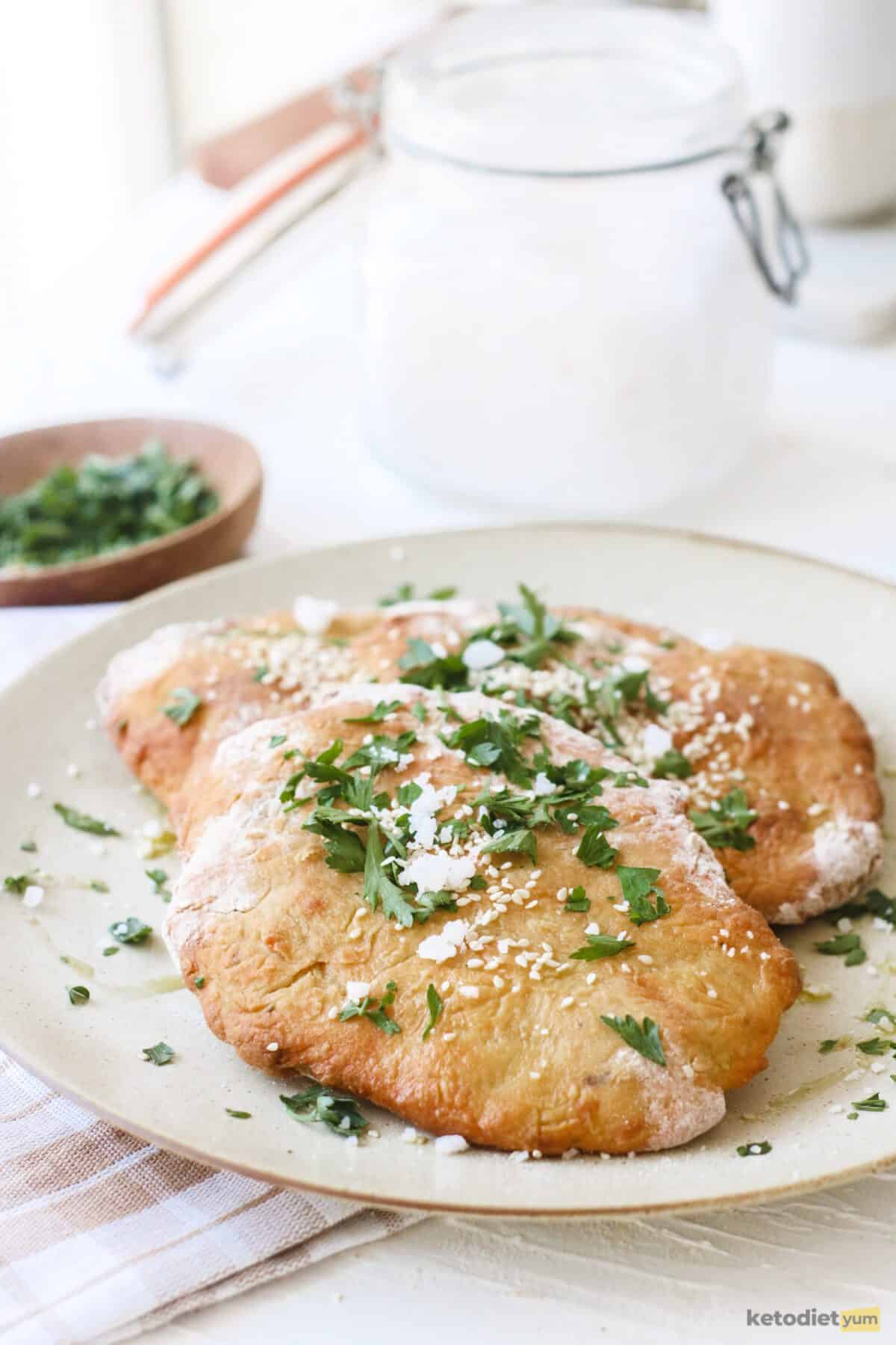 Perfectly golden keto naan bread on a plate ready to enjoy