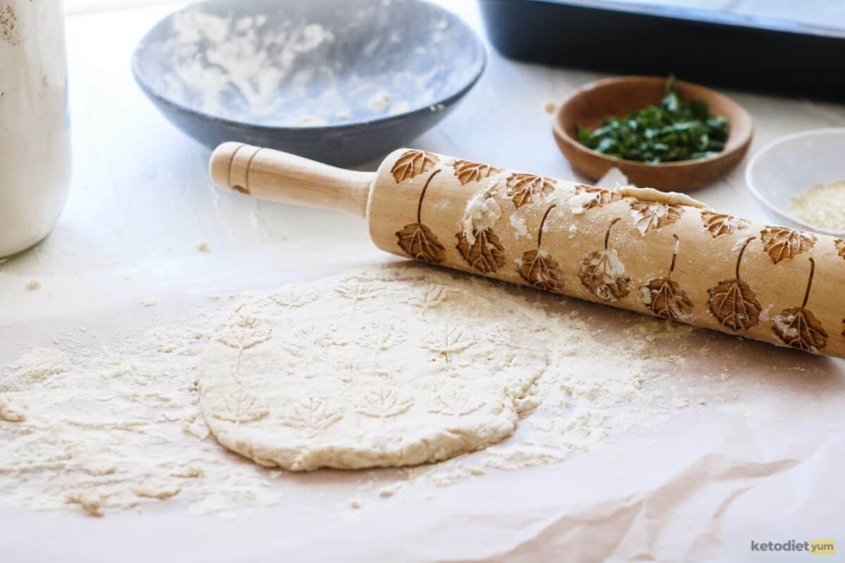 Rolling out the keto naan bread dough ready to transfer to a lined baking pan and bake