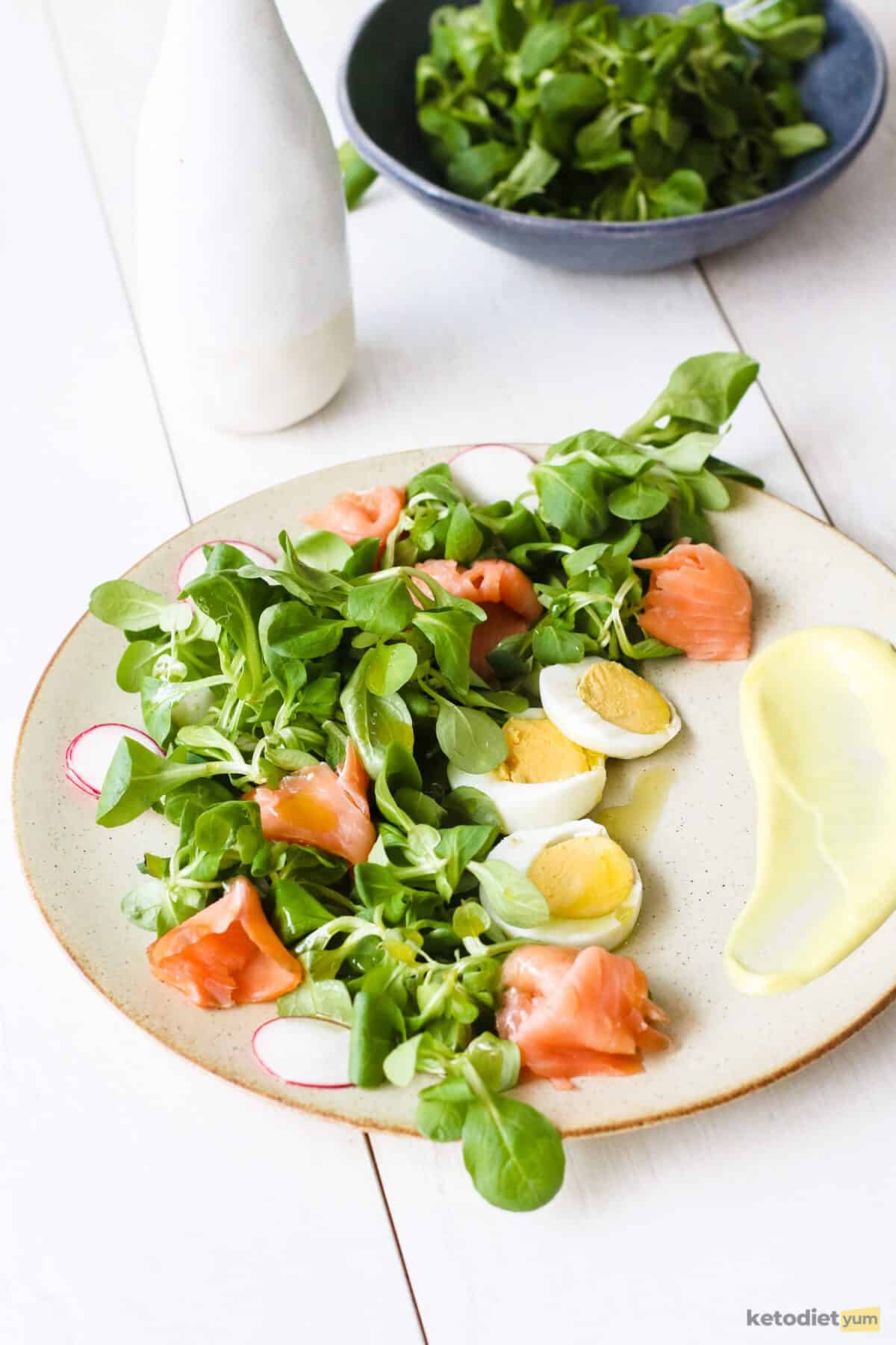 A quick and easy smoked salmon salad with valerian, radish, eggs and a mayonnaise and mustard dressing