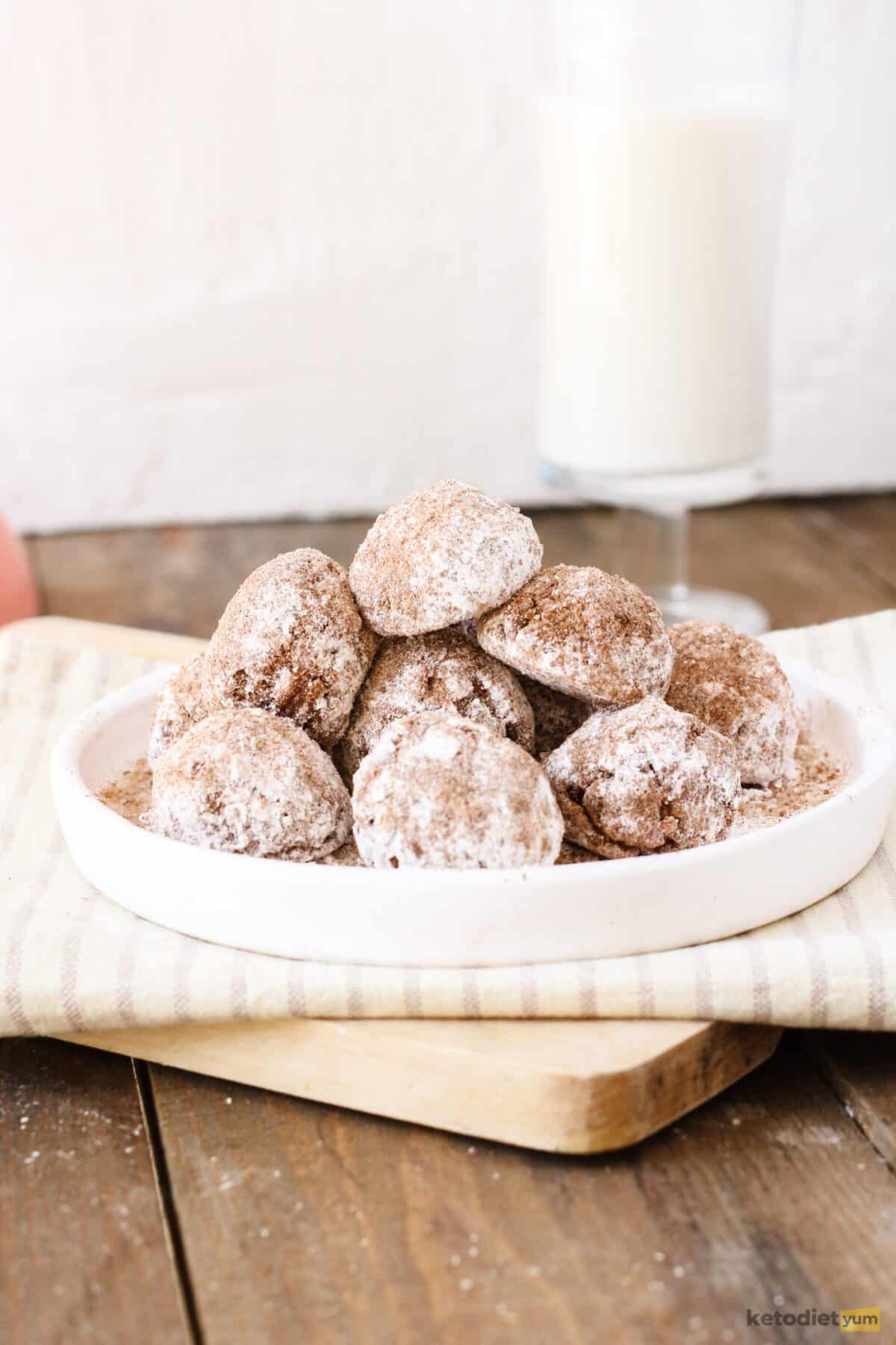 Delicious low carb donut holes coated with powdered Erythritol, granulated Erythritol and ground cinnamon