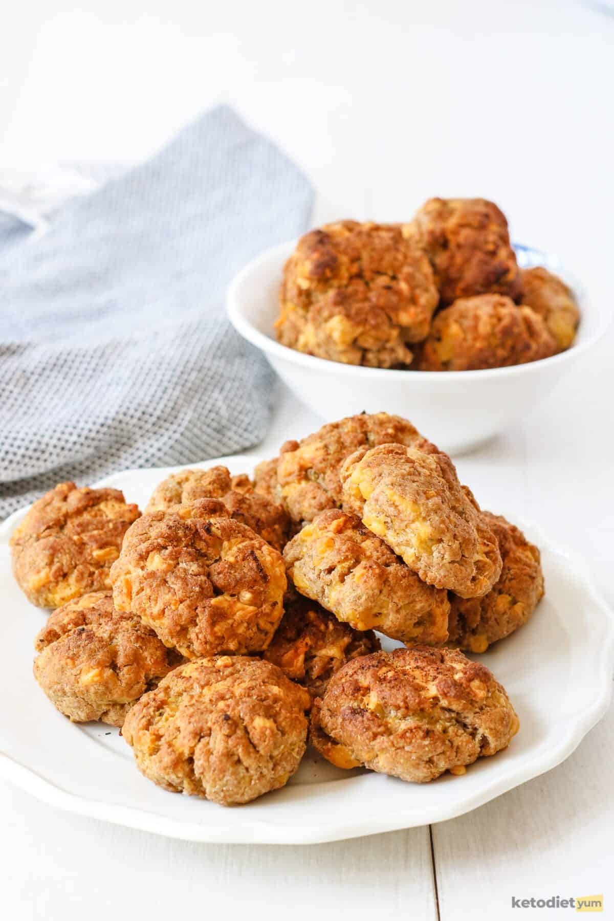 Keto cheddar biscuits fresh out of the oven served on a white plate