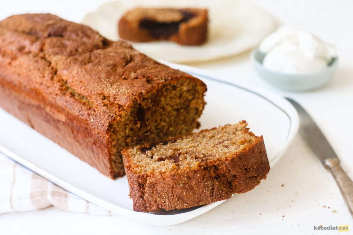 A delicious low carb cinnamon swirl cake sliced on a serving plate