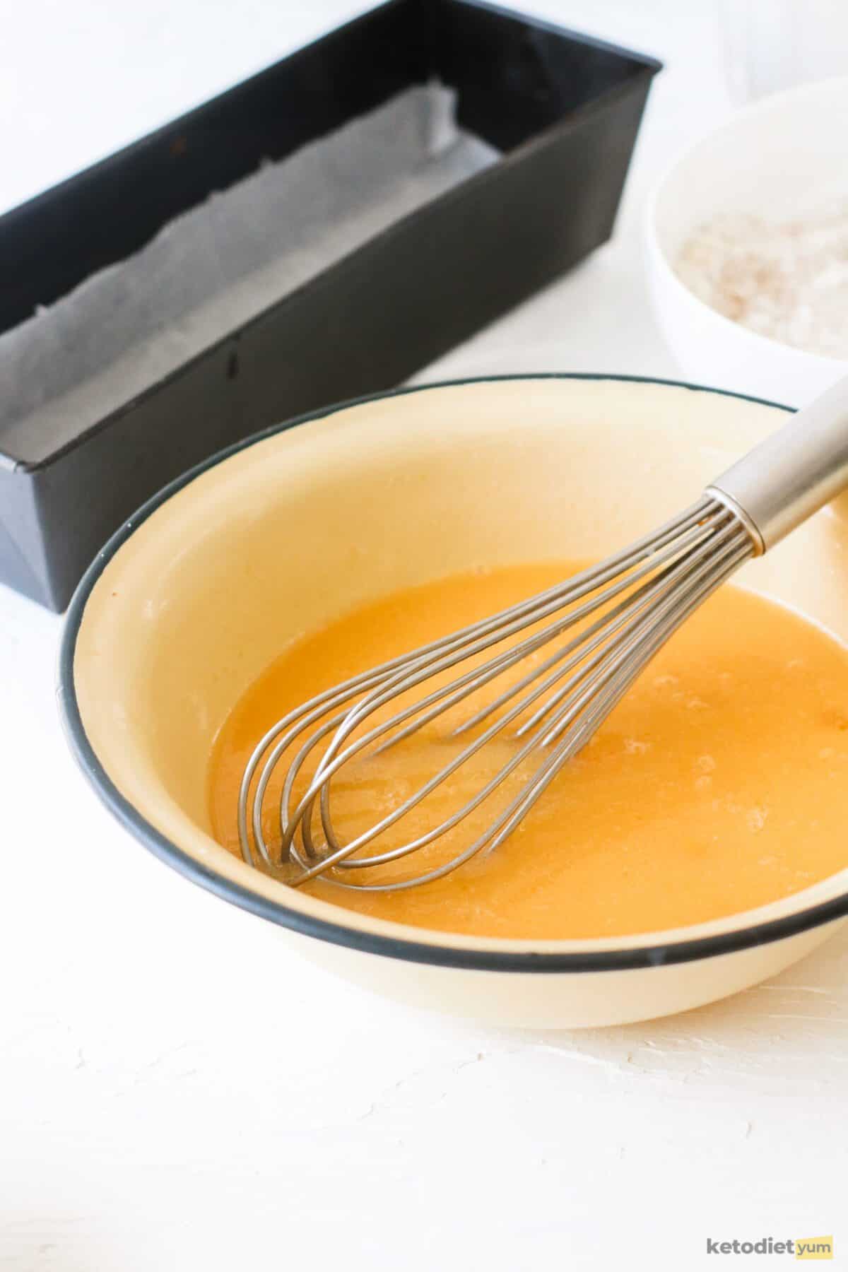 Eggs, Erythritol, sunflower oil, almond milk and vanilla essence combined in a mixing bowl