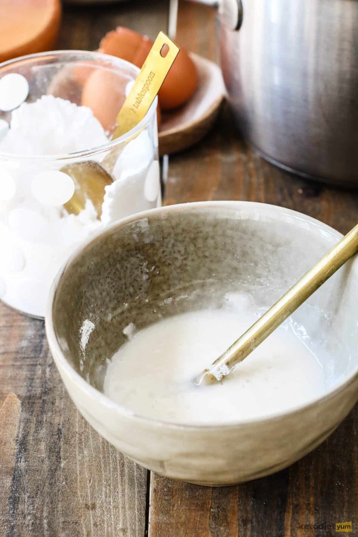 Small bowl on a table filled with glaze