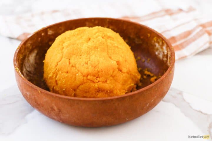 Bowl with marzipan dough on a table